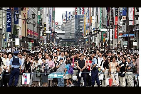 Japan's population drops by record number to 124.8mn
