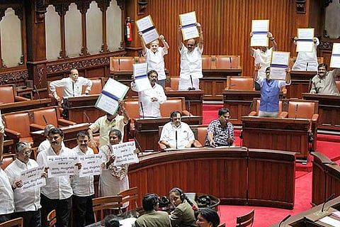 BJP members stage a protest demanding the resignation of the Karnataka CM HD Kumaraswamy