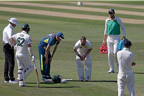 Matt Wade receives treatment to his right elbow