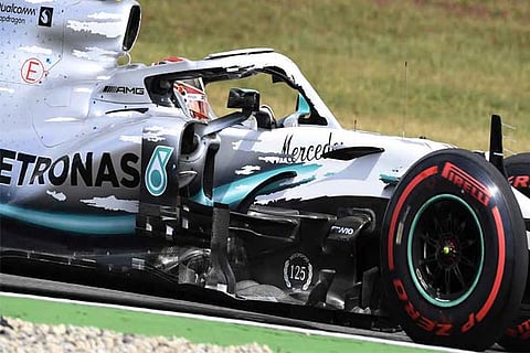 Hamilton takes pole as technical failures rule Ferrari out