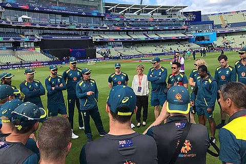 The Australian team during a warm-up session along with coach Justin Langer
