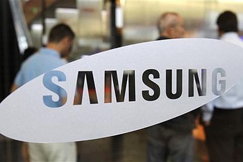Samsung's profit halves on weak chip, smartphone sales in Q2