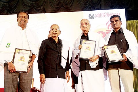 Dravidar Kazhagam president and editor of Viduthalai K Veeramani releasing a special issue and honouring award