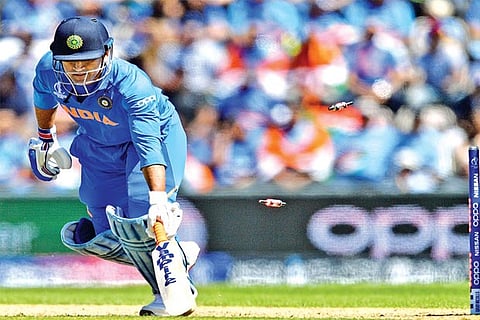 India wicket-keeper MS Dhoni is stumped by Ikram Alikhil off Rashid Khan for 28