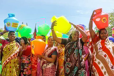 DMK cadre with empty pots, condemning the govt?s failure to address the situation during a stir, in Chennai