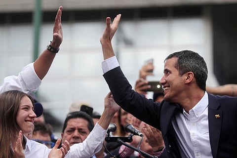 Venezuelan leader Juan Guaido greets supporters during a rally in Caracas