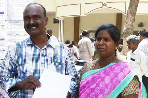 The couple, Rajeswari and Babu, with a copy of their petition at the Vellore collectorate on Monday