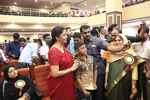 Minister Nirmala Sitharaman posing for a selfie at the launch of PMSYM in Chennai on Tuesday