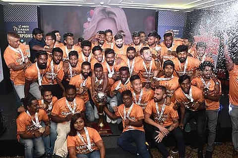 Chennai City players celebrate with the trophy