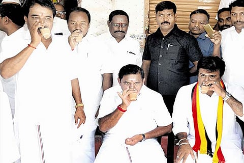 CM and DMDK candidate LK Sudhish have tea at a roadside shop in Salem