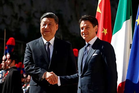 Chinese President Xi Jinping shakes hands with Italian Prime Minister Giuseppe Conte