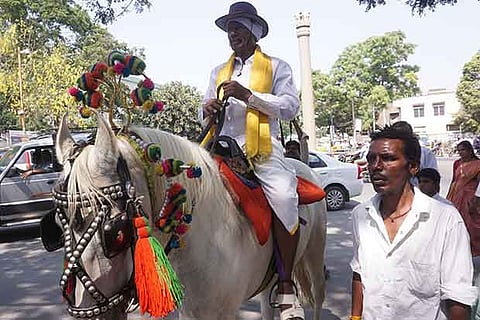 Independent candidate Noor Muhammed comes on a horse to file nomination in Coimbatore on Tuesday.