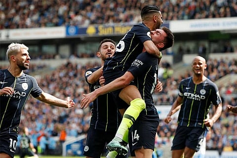 Man City batter Brighton to retain Premier League title