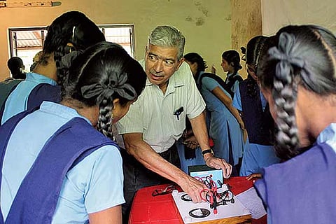 Post-retirement phase: An elderly man teaching students in a government school