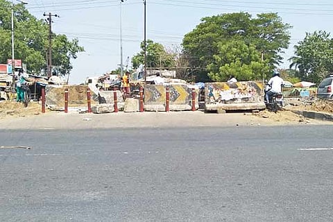 A man trying to enter the village using the blocked road in Guduvanchery
