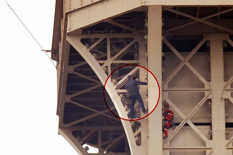 Eiffel Tower evacuated after climber scales monument
