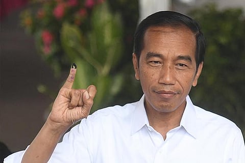 Indonesia curbs social media, blaming hoaxes for inflaming unrest