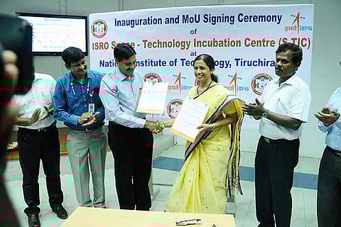 P V Venkatakrishnan of ISRO and Mini Shaji Thomas, Director, NIT-T, exchange MoU documents at an event held