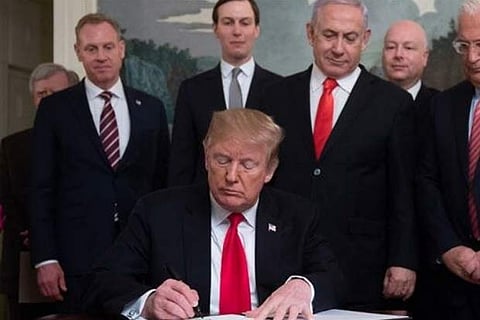 Trump signs 'nice' on map showing Golan as Israel's part