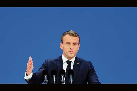Macron urges China to bring end to trade war with US