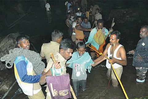 The devotees, stranded in the streams, being rescued early on Sunday