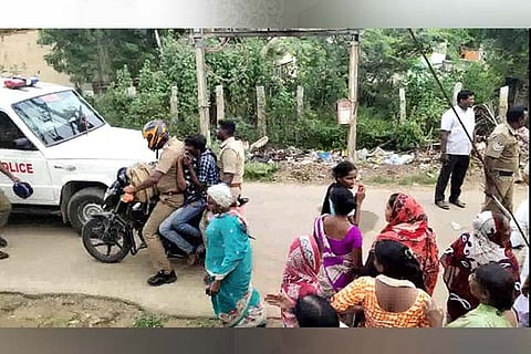 Policemen taking the teenagers on a bike