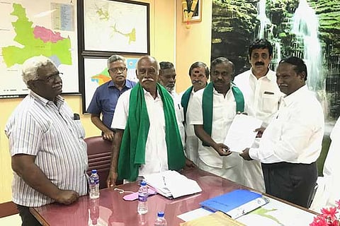 Farmers, led by PR Pandian, with the Chief Engineer on Monday in Tiruchy