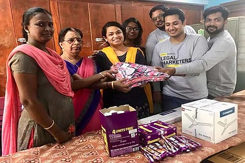 Volunteers donate essentials to a member through iAdvocate campaign