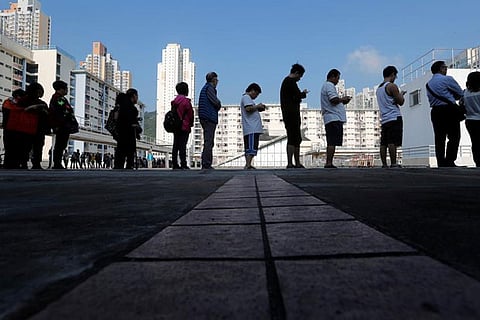 Record turnout for Hong Kong council elections amid calls for full democracy