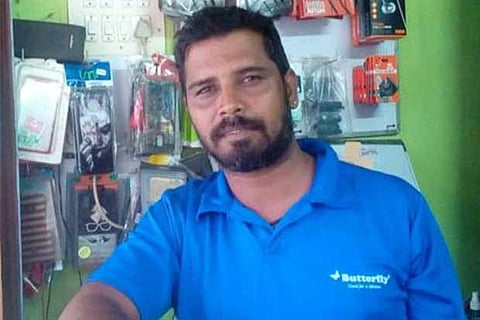 Cyril Alfred R, 38, runs a phone shop