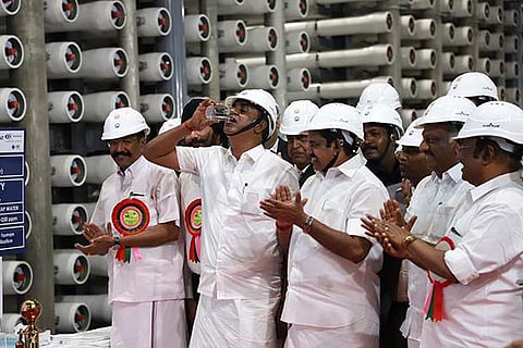 Municipal Administration Minister SP Velumani drinks a glass of water treated at the plant