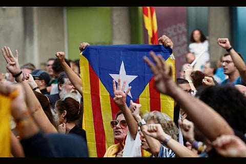 Spain jails Catalan separatist leaders, protesters take to streets