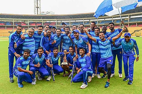 The triumphant Karnataka team poses with the Vijay Hazare Trophy after defeating Tamil Nadu in the final