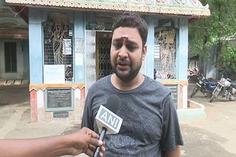 Jitu, one of the devotees at Meenakshi Amman Temple on Sunday