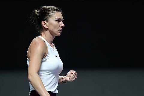 WTA Finals: Halep rallies to beat Andreescu