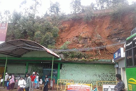 Mud over the concrete bus shelter in Kotagiri after the landslip on Tuesday