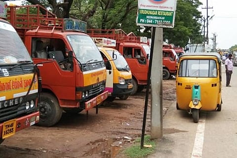 Trucks parked in the no-parking zone along Cantonment Road at Pallavaram