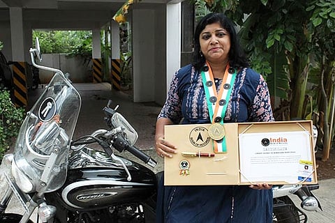 Kalaivani with her record for the longest solo bike ride