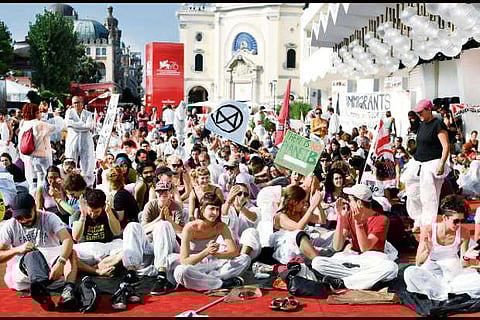 Climate change activists storm red carpet at Venice Film Festival