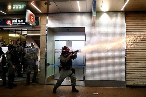 Hong Kong police fire tear gas as clashes erupt after thousands appeal to Trump