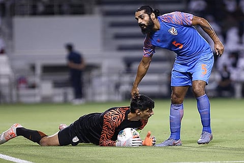 Gurpreet Singh Sandhu (in black) was a wall between the posts for India against Qatar.