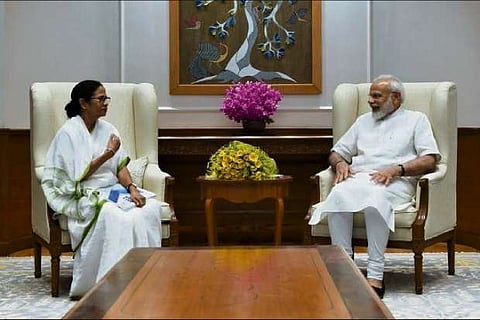 Mamata meets Modi with sandesh, seeks his help