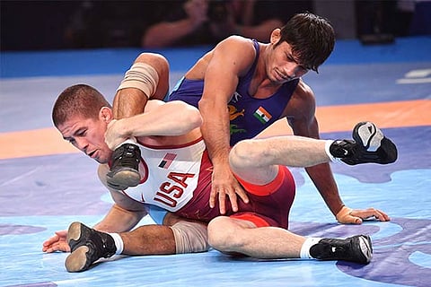 Rahul Aware (in blue) got the better of Tyler Lee Graff in the 61kg bronze medal play-off