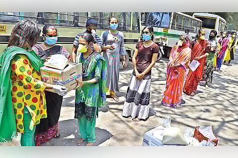 Transpersons collecting aid for distribution at Chetpet on Tuesday