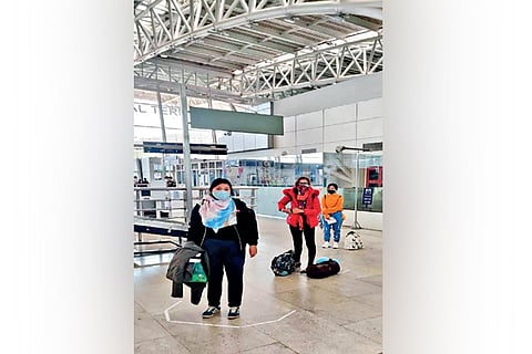 Passengers queue up for their flights at Chennai airport