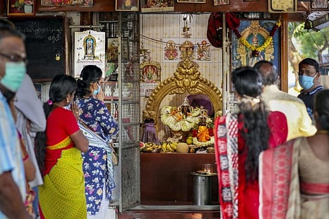 Devotees offer prayers on the occasion of Tamil New Year at a temple in Coimbatore