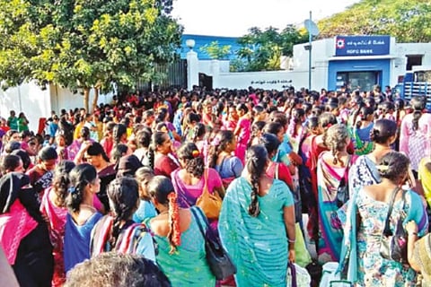 Workers walking out of a tannery in Ambur after the announcement of the nationwide lockdown