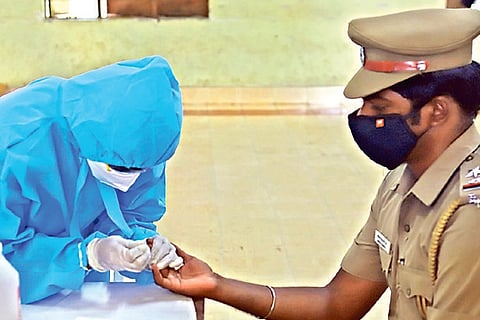 A policeman undergoing test for COVID-19 in city