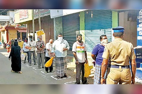 File photo of cardholders maintaining social distance in front of a PDS shop in Coimbatore