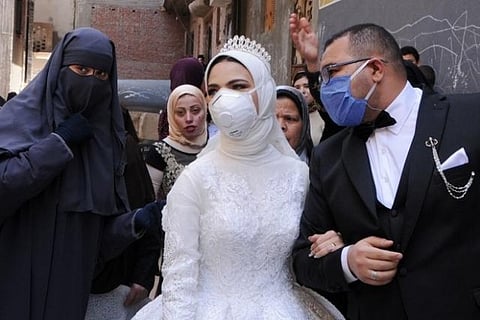 Coronavirus means low-key, cost-saving wedding for one Egyptian couple